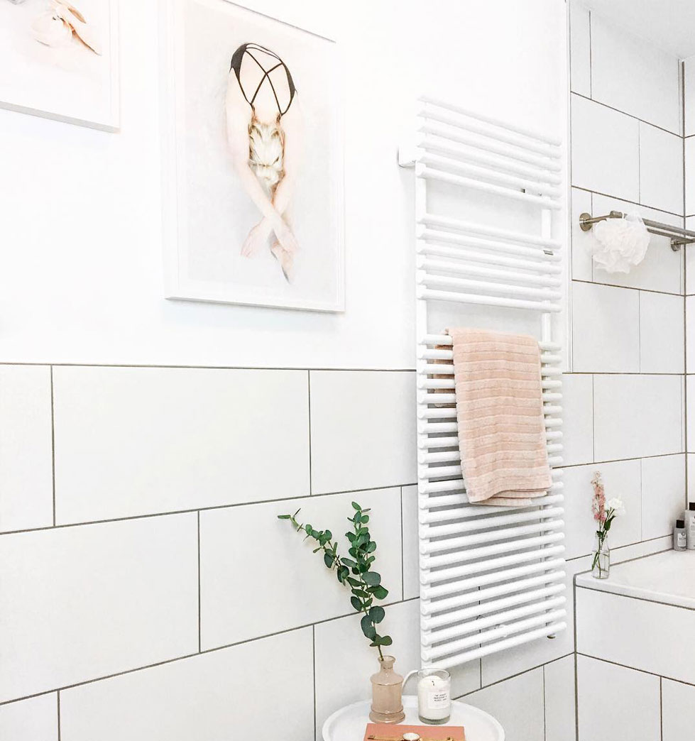 Hang your own photos in the bathroom