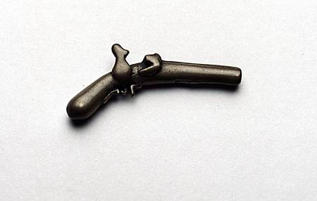Gold weight cast in the form of a pistol from Akan School