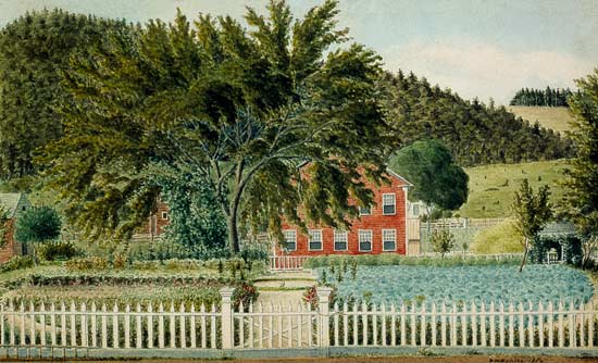 View of a Red House with a Picket Fence from American School