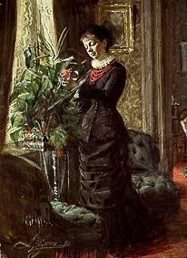 Mrs Lisen Samson when arranging flowers in front of a window