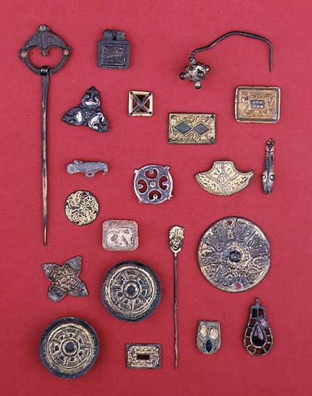 Collection of Anglo-Saxon and Celtic jewellery including gilt bronze mountssaucer and cruciform broo from Anonymous painter