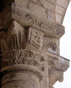Column capital with stylised foliage designs around the figure of an acrobatfrom the porch exterior