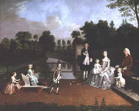 A Family Group on a Terrace in a Garden