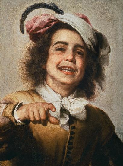 Laughing boy with a feather adorned headdress.