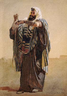A Jerusalemite Shepherd Winding the Phylacteries for the Hand