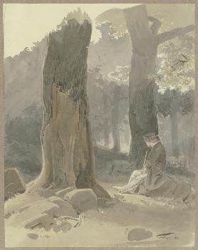 Jäger bei Königstein-Falkenstein auf einem Stein im Wald sitzend