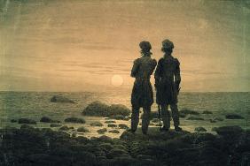 Two men at moonrise by the sea