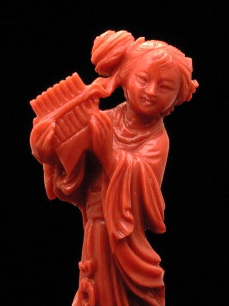 Statuette of a maiden with a piped musical instrument from Chinese School