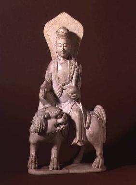 Figure of the Bodhisattva Guanyin, holding a vase with a willow twig and sitting on a Buddhist lion,
