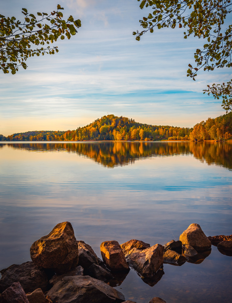 Autumn lake with a small mountain in the background from Christian Lindsten