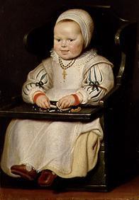 Portrait of a little girl in the child small chair