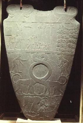 The Narmer Palette: ceremonial palette depicting King Narmer, wearing the red crown of Lower Egypt,