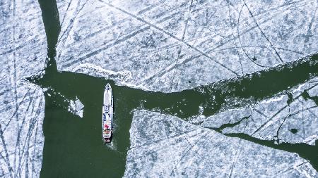 Boat on icy lake