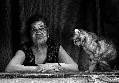 Lady at the window with her cat