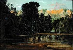 A Wooded Landscape at Sunset