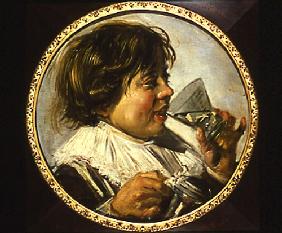 Half-length portrait of a laughing boy with a wine-glass