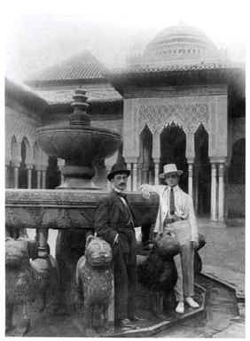 Leonid Massine (1895-1979) and Manuel de Falla (1876-1946) standing in the Court of the Lions at the