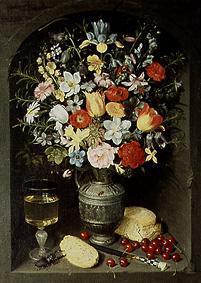 Bouquet of flowers being in a niche in a silver jug.