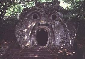 Mouth of a fantastical cave, stone sculpture in the 'Parco dei Mostri' (Monster Park) gardens laid o