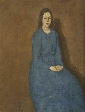 Eine junge Frau in einem blauen Kleid