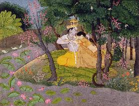 Radha and Krishna embrace in a grove of flowering trees