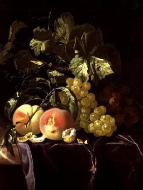 Still Life of fruit, nuts and leaves on velvet cloth