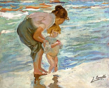 Mother and child on the beach.