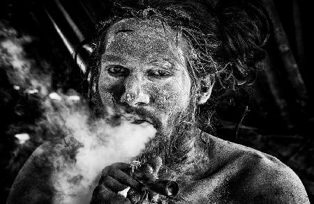 Naga Baba smoking a chilum-I - Kumbh Mela - Prayagraj - India