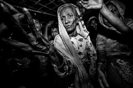 Distributing clothes and money among the Rohingyas-VI