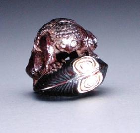 Netsuke depicting a kappa crouching on a clam shell