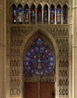 View looking west from the nave, rose window designed by Bernard de Soissons, with surrounding statu