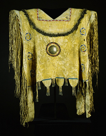 An Apache Beaded And Fringed Buckskin Poncho, Painted With Yelloe Ochre And Decorated With Tin Cones from 