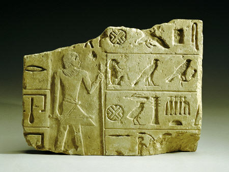 An Egyptian Limestone Relief Fragment from 