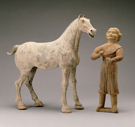 A Painted Grey Pottery Group Of A Horse And Groom from 