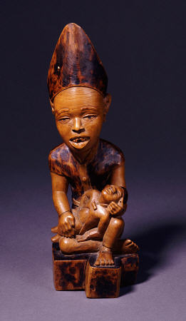 A Yombe Wood Carving Possibly Depicting A King Or Chief Presenting His Son from 