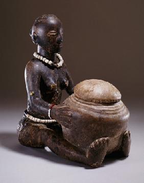 A Luba Figure Of A Seated Female Holding A Round Bowl