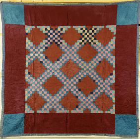 An Amish Pieced Cotton And Wool Quilted Coverlet