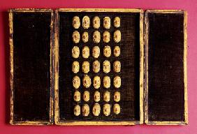 A Rare Set Of Thirty-Five Carved, Vegetable-Ivory Representations Of The Human Face, Depicting Vario