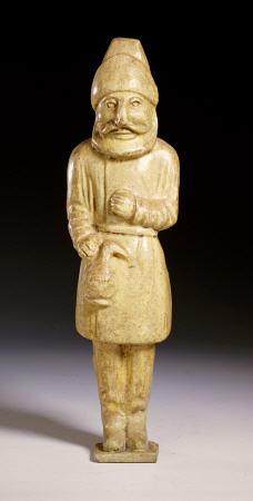 A Rare Straw-Glazed Figure Of A Semitic Wine Merchant