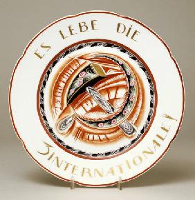 A Soviet Porcelain  Propaganda Plate, With Allegorical Hammer And Sickle  ''Es Lebe Die 3 Internatio