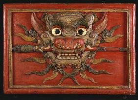 A Tibetan Polychrome Wooden Panel Carved In High Relief With A Kala Mask, 19th Century