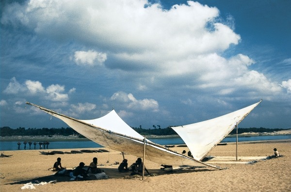 Fishermen mending their nets under shade of triangular sails, Gopalpur (photo)  from 
