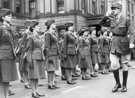 General Charles de Gaulle during review of young women of Free French Forces at Wellington barracks 