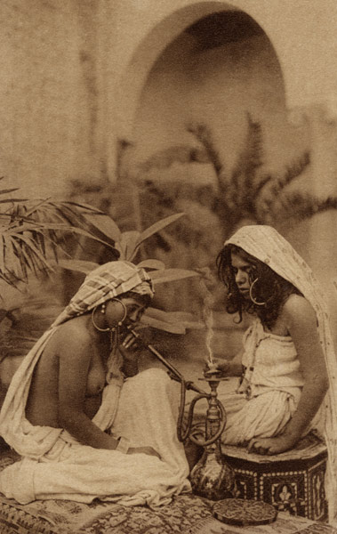 Harem girls smoking a hookah, from an early 20th century postcard (sepia photo)  from 
