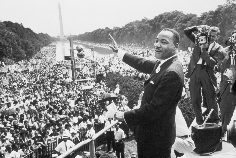 Martin Luther King American priest activist for Civil Right Movement of black Americans saluting the from 