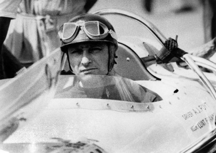 racing driver Fangio here at the wheel during race in Monza from 