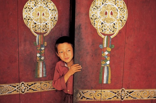 Young initiate outside main door of Pemyangtse monastery (photo)  from 