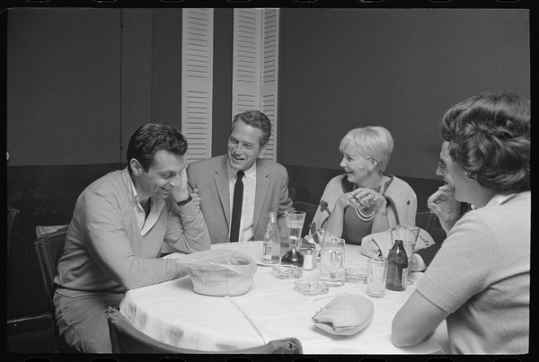 Paul Newman, Mort Sahl and Joanne Woodward joking at dinner from Orlando Suero