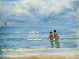 Boys in the sea at Skagen taking a bath