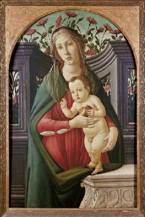 Madonna with child in a niche decorated with roses